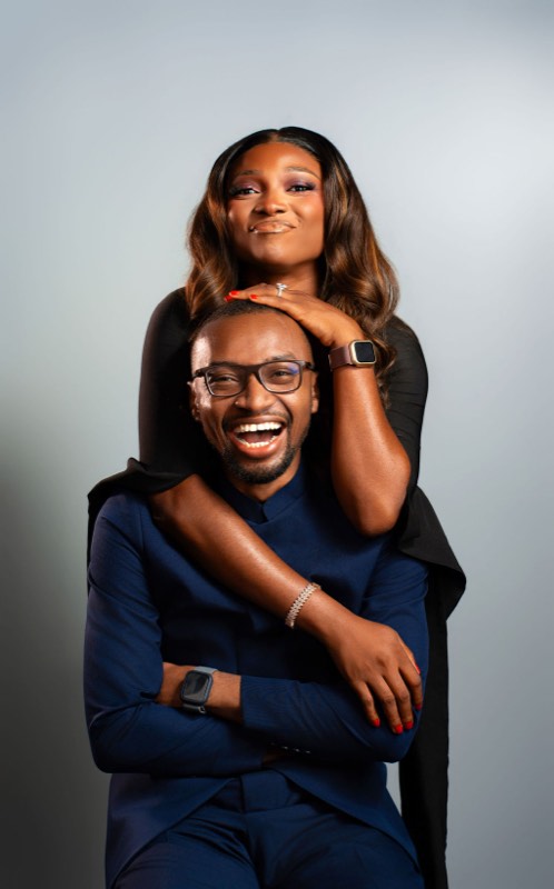 Akachi with her arms around Sommie, both laughing