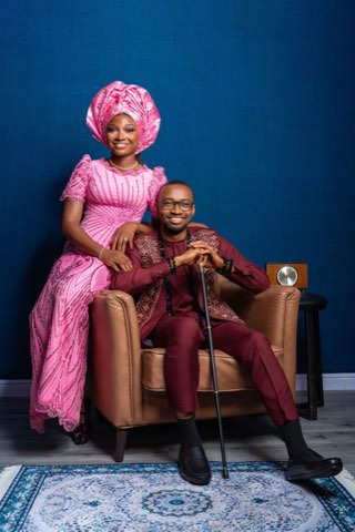 The couple seated together in traditional Igbo attire