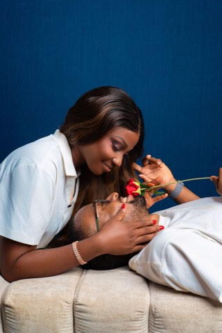 Akachi offering Sommie a red rose