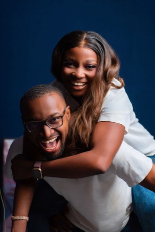 The couple embracing and laughing